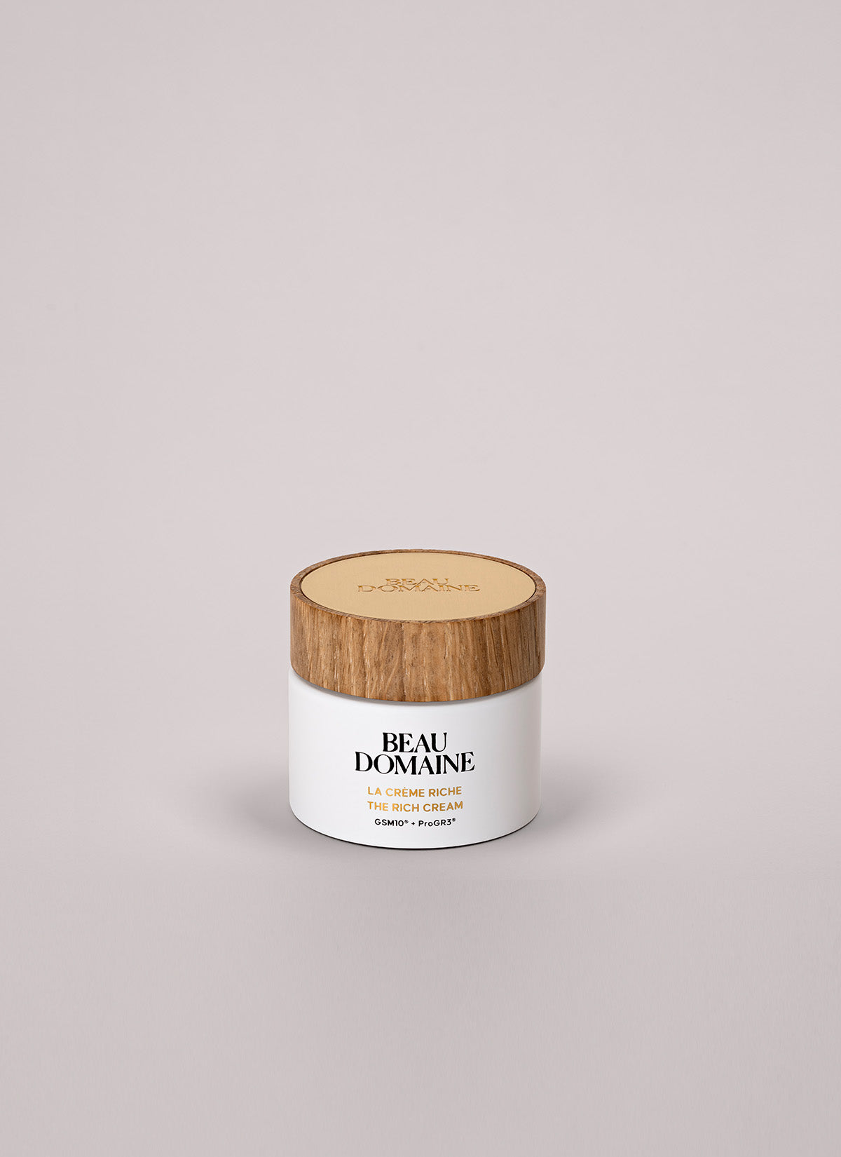 the rich cream with its wooden cap and sleek base 